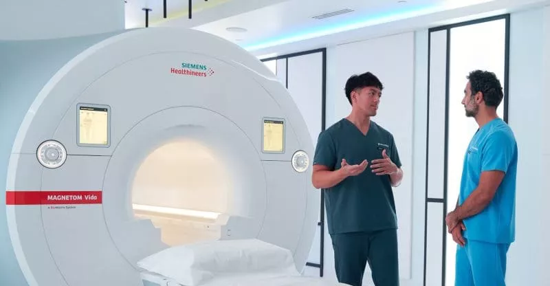 SimonMed MRI team helping a patient prepare for an exam